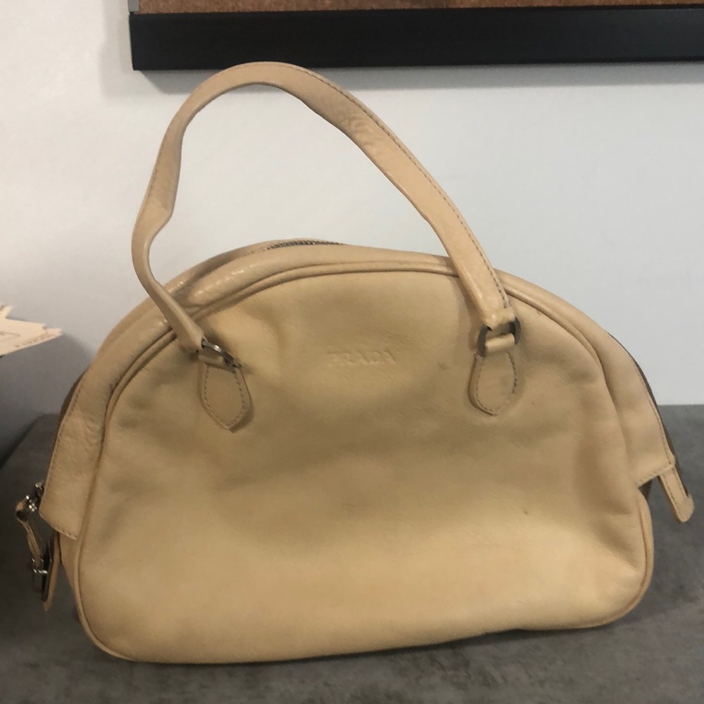 Bowling ball shaped nude leather Prada bag